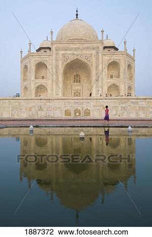 Tourist Walking By The Taj Mahal At Dusk View Large Photo Image Stock Image - Tourist Walking By The Taj Mahal At Dusk. Fotosearch