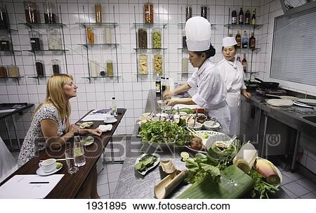 Stock Photography - Tourist With Cooks Metropole Hotel Cookery School; Hanoi Vietnam. Fotosearch