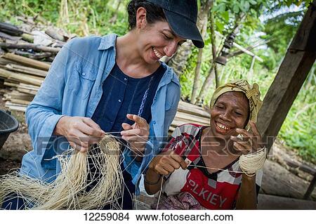 Tourist with local artisan; Timor-Leste View Large Photo Image Picture - Tourist with local artisan; Timor-Leste. Fotosearch