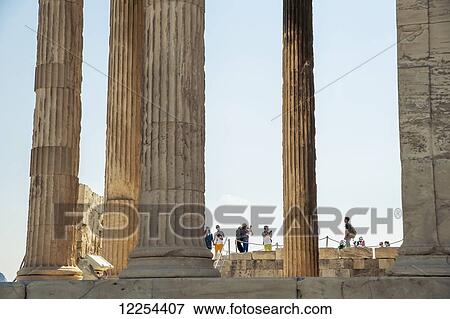 Stock Photo - Tourists among the columns of the Acropolis; Athens, Greece. Fotosearch