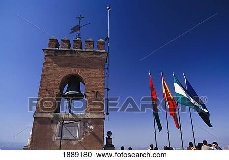Stock Image - Tourists And Flags On Top Of The Alcazaba, Alhambra Fortress. Fotosearch