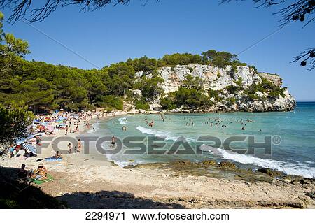 Stock Image - Tourists At Cala Macarella, Menorca, Balearic Islands, Spain. Fotosearch