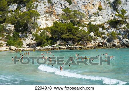 Tourists At Cala Macarella, Menorca, Balearic Islands, Spain View Large Photo Image Stock Photo - Tourists At Cala Macarella, Menorca, Balearic Islands, Spain. Fotosearch