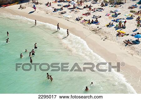 Tourists At Cala Macarelleta, Menorca, Balearic Islands, Spain View Large Photo Image Stock Photo - Tourists At Cala Macarelleta, Menorca, Balearic Islands, Spain. Fotosearch