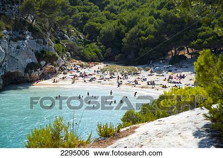 Stock Photograph - Tourists At Cala Macarelleta, Menorca, Balearic Islands, Spain. Fotosearch