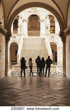 Stock Image - Tourists at Doge's Palace; Venice, Italy. Fotosearch