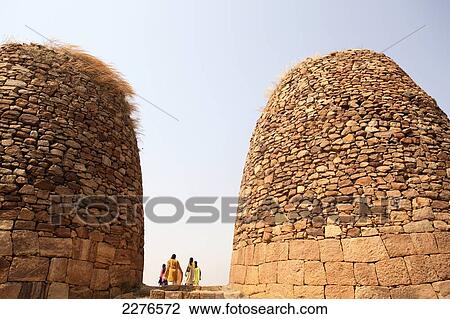 Tourists at domed stone structures; Badami, Karnatak, India View Large Photo Image Stock Image - Tourists at domed stone structures; Badami, Karnatak, India. Fotosearch