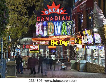 Stock Photograph - Tourists At Great Canadian Midway At Night; Niagara Falls Ontario Canada. Fotosearch