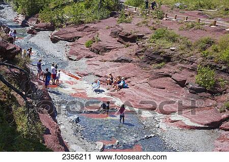 Tourists At Red Rock Canyon In Waterton Lakes National Park; Alberta, Canada View Large Photo Image Stock Image - Tourists At Red Rock Canyon In Waterton Lakes National Park; Alberta, Canada. Fotosearch
