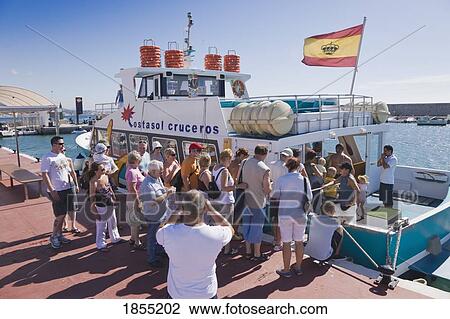 Stock Image - Tourists Boarding Excursion Boat, Fuengirola, Malaga, Spain. Fotosearch
