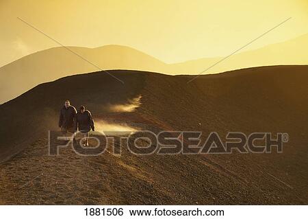 Stock Photograph - Tourists Climbing Mount Etna; Taormina, Sicily, France. Fotosearch