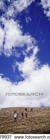 Stock Photo - Tourists Climbing Mountain. Fotosearch