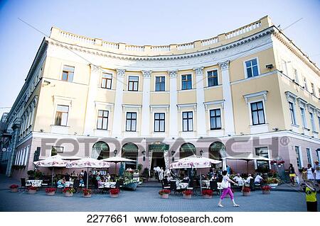 Tourists dining in street cafes outside historic buildings in Odessa city centre; Odessa, Ukraine View Large Photo Image Stock Image - Tourists dining in street cafes outside historic buildings in Odessa city centre; Odessa, Ukraine. Fotosearch