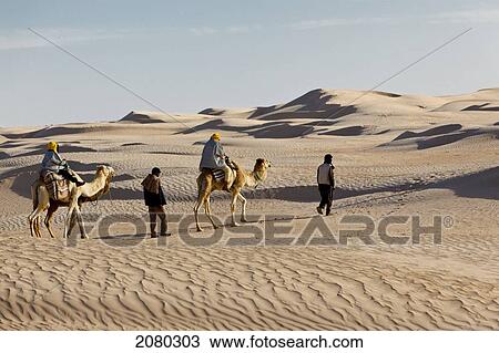 Tourists Enjoying A Camel Ride In The Desert Zaafrane Tunisia North Africa Stock Image 2080303 Fotosearch