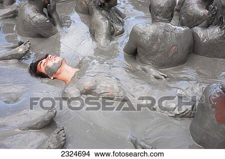 Picture - Tourists Getting Skin Enhancing Treatment At El Totumo Mud Volcano, Catagena, Colombia. Fotosearch