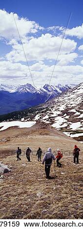 Stock Photo - Tourists Hiking In The Rockies. Fotosearch