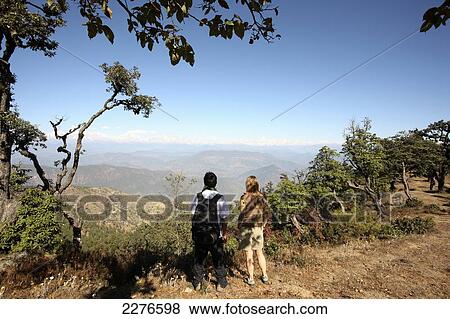 Tourists hiking on the Kumaon trek in Indian Himalayas; Utaranchal, India View Large Photo Image Stock Photo - Tourists hiking on the Kumaon trek in Indian Himalayas; Utaranchal, India. Fotosearch