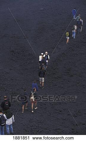 Stock Image - Tourists Hiking Volcan Pacaya. Fotosearch