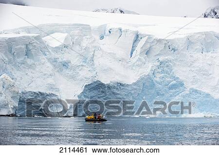 Tourists In A Boat Beside The Frozen Coastline; Antarctica View Large Photo Image Stock Image - Tourists In A Boat Beside The Frozen Coastline; Antarctica. Fotosearch