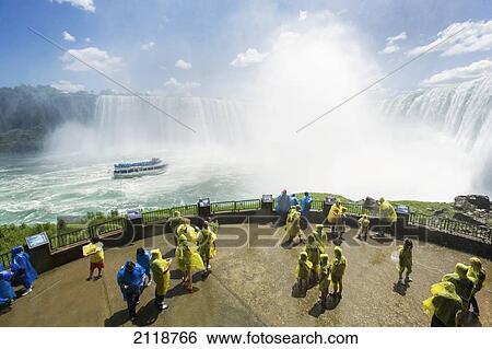 Stock Photograph - Tourists In Raincoats On Observation Deck; Niagara Falls Ontario Canada. Fotosearch