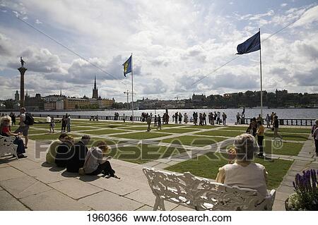 Tourists In The City Hall Gardens On Lake Malaren; Stockholm, Sweden View Large Photo Image Stock Photograph - Tourists In The City Hall Gardens On Lake Malaren; Stockholm, Sweden. Fotosearch