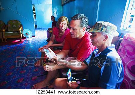 Tourists inside a local house in the floating village; Bandar Seri Begawan, Brunei View Large Photo Image Stock Image - Tourists inside a local house in the floating village; Bandar Seri Begawan, Brunei. Fotosearch