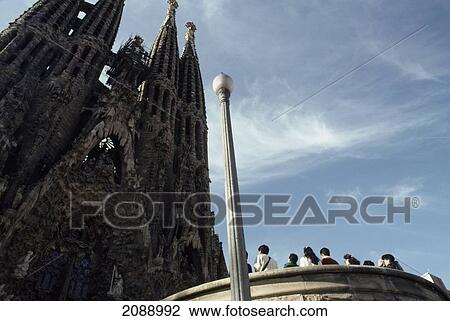 Stock Image - Tourists Look At Ruins Of A Building. Fotosearch