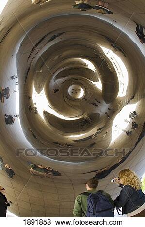Stock Photo - Tourists Looking At Cloud Gate Sculpture In Millennium Park. Fotosearch