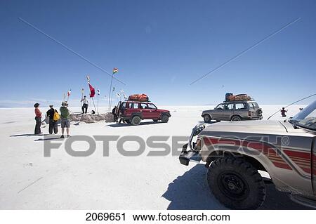 Tourists Next To 4X4 Vehicles On The Salar De Uyuni, The World's Largest Salt Flat, Potosi Department, Bolivia View Large Photo Image Stock Image - Tourists Next To 4X4 Vehicles On The Salar De Uyuni, The World's Largest Salt Flat, Potosi Department, Bolivia. Fotosearch