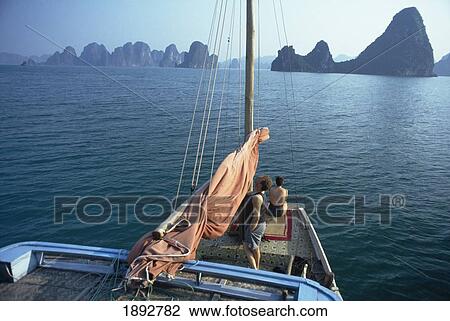 Stock Image - Tourists On Boat Cruising On Halong Bay, Elevated View. Fotosearch