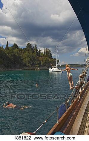 Stock Image - Tourists On Ms Christina Cruise Ship Near Island Owned By Onasis Family. Fotosearch