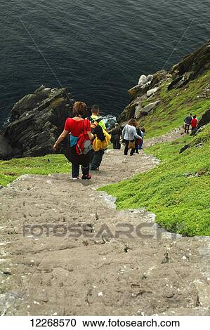 Tourists on the Skelligs island off the Kerry coast on the Wild Atlantic Way; County Kerry, Ireland View Large Photo Image Stock Image - Tourists on the Skelligs island off the Kerry coast on the Wild Atlantic Way; County Kerry, Ireland. Fotosearch