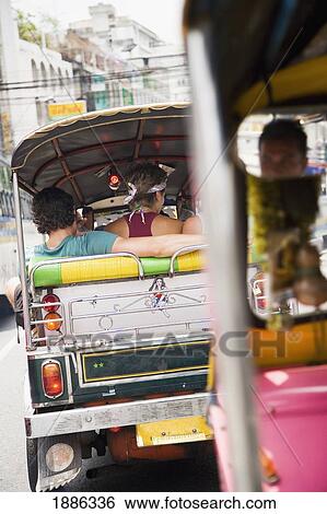 Stock Photograph - Tourists On Tuk Tuk In Bangkok. Fotosearch