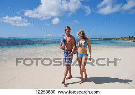 Tourists relaxed and walking on the beach; Savaii Island, Samoa View Large Photo Image Stock Image - Tourists relaxed and walking on the beach; Savaii Island, Samoa. Fotosearch
