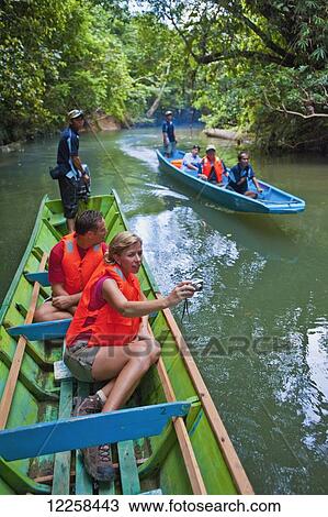 Tourists river boating at Ulu Temburong National Park; Brunei View Large Photo Image Stock Image - Tourists river boating at Ulu Temburong National Park; Brunei. Fotosearch