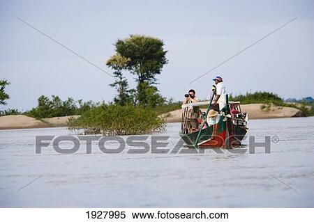 Tourists Sailing Boat On Mekong River, Kampi, Cambodia View Large Photo Image Stock Photography - Tourists Sailing Boat On Mekong River, Kampi, Cambodia. Fotosearch