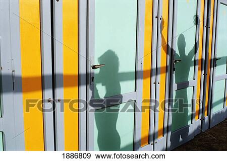 Stock Photo - Tourists' Shadows In Beach Huts. Fotosearch