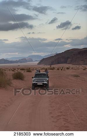 Tourists Sitting In The Back Of A 4X4 Vehicle Before Being Transported To A Captain's Eco Desert Camp, Wadi Rum, Jordan, Middle East View Large Photo Image Stock Image - Tourists Sitting In The Back Of A 4X4 Vehicle Before Being Transported To A Captain's Eco Desert Camp, Wadi Rum, Jordan, Middle East. Fotosearch
