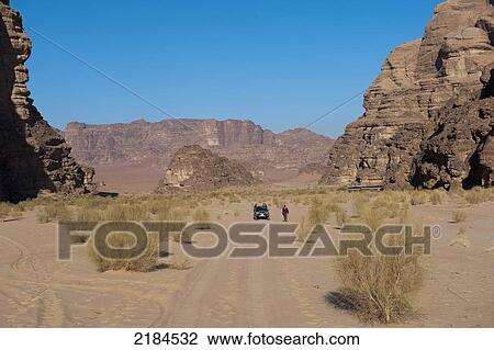 Tourists Travelling By 4X4 Jeep In Wadi Rum, Jordan, Middle East View Large Photo Image Stock Image - Tourists Travelling By 4X4 Jeep In Wadi Rum, Jordan, Middle East. Fotosearch