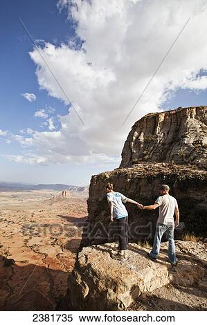Stock Photography - Tourists trekking in the amazing mountain scenery on the Gheralta plateau; Tigray region, Ethiopia. Fotosearch