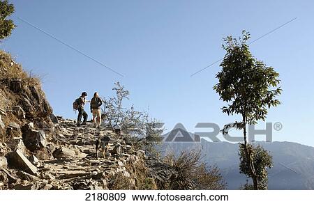 Tourists trekking in the himalayas; India View Large Photo Image Stock Photo - Tourists trekking in the himalayas; India. Fotosearch
