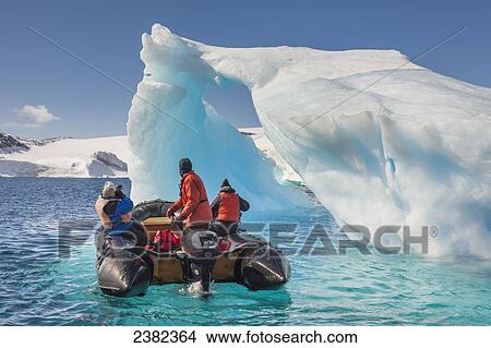 Picture - Tourists view icebergs near Devil Island, northeast side of the Antarctic peninsula; Antarctica. Fotosearch