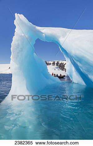 Tourists view icebergs near Devil Island, northeast side of the Antarctic peninsula; Antarctica View Large Photo Image Stock Photography - Tourists view icebergs near Devil Island, northeast side of the Antarctic peninsula; Antarctica. Fotosearch