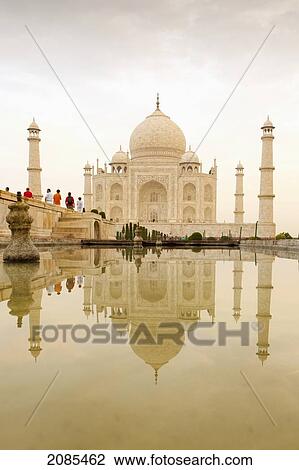 Stock Image - Tourists Visit The Taj Mahal; Agra Uttar Pradesh India. Fotosearch