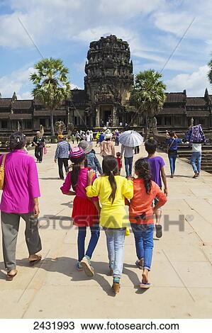 Stock Image - Tourists visiting Angkor Wat; Cambodia. Fotosearch