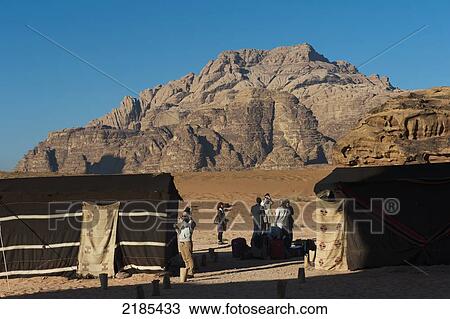 Stock Image - Tourists Waiting To Be Transported Back From The Captain's Eco Desert Camp, Wadi Rum, Jordan, Middle East. Fotosearch