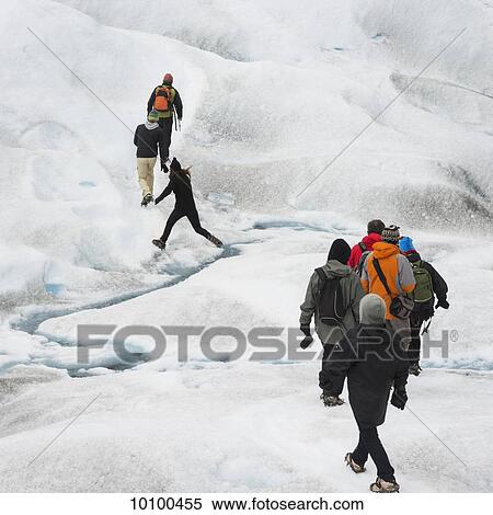 Tourists walk on Moreno Glacier, Los Glaciares National Park; Santa Cruz province, Argentina View Large Photo Image Stock Photography - Tourists walk on Moreno Glacier, Los Glaciares National Park; Santa Cruz province, Argentina. Fotosearch
