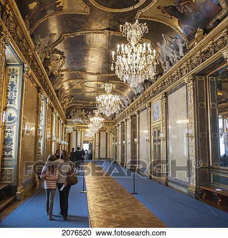 Stock Image - Tourists Walking In A Corridor Of Stockholm Palace; Stockholm Sweden. Fotosearch
