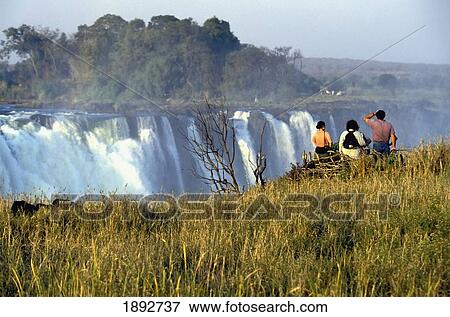 Tourists Watching Victoria Falls View Large Photo Image Stock Photo - Tourists Watching Victoria Falls. Fotosearch