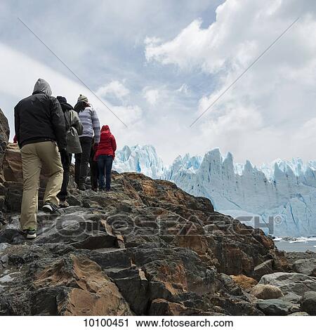 Stock Image - Tourists with a view of Moreno Glacier, Los Glaciares National Park; Santa Cruz province, Argentina. Fotosearch